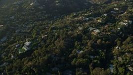 7.6K aerial stock footage flying away from hillside mansions in Beverly Hills, California Aerial Stock Footage | AX0161_103
