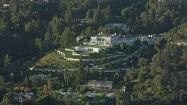 7.6K aerial stock footage flying by a large hillside mansion in Beverly Hills, California Aerial Stock Footage | AX0161_107