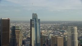 7.6K aerial stock footage flying by the Wilshire Grand Center skyscraper in Downtown Los Angeles, California Aerial Stock Footage | AX0162_013E