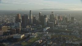 7.6K aerial stock footage flying past skyscrapers on a hazy day in Downtown Los Angeles, California Aerial Stock Footage | AX0162_022E