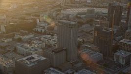 7.6K aerial stock footage approaching Transamerica Center at sunset in Downtown Los Angeles, California Aerial Stock Footage | AX0162_067