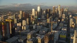7.6K aerial stock footage of skyscrapers seen from Oceanwide Plaza at sunset in Downtown Los Angeles, California Aerial Stock Footage | AX0162_069E