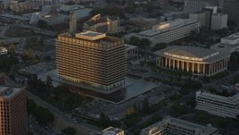 7.6K aerial stock footage approaching LADWP office building at twilight in Downtown Los Angeles, California Aerial Stock Footage | AX0162_072