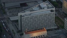 7.6K aerial stock footage approaching the LAPD headquarters at twilight in Downtown Los Angeles, California Aerial Stock Footage | AX0162_073