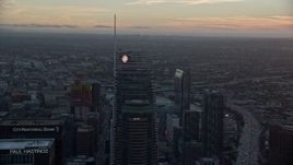 7.6K aerial stock footage of tops of Wilshire Grand Center and US Bank Tower at sunset in Downtown Los Angeles, California Aerial Stock Footage | AX0162_090