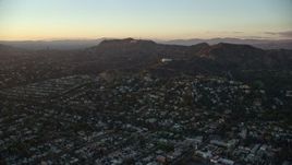7.6K aerial stock footage flying over Los Feliz to approach the Hollywood Sign and Griffith Observatory in Los Angeles, California at twilight Aerial Stock Footage | AX0162_098
