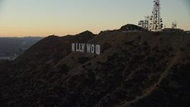 7.6K aerial stock footage approaching the famous Hollywood Sign at twilight in Los Angeles, California Aerial Stock Footage | AX0162_107E