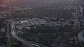 7.6K aerial stock footage of the Warner Bros Studio lot at sunset in Burbank, California  Aerial Stock Footage | AX0162_110