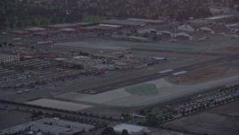 7.6K aerial stock footage orbiting the end of a runway and terminals at twilight at Burbank Airport, California  Aerial Stock Footage | AX0162_114