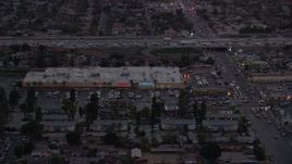 7.6K aerial stock footage of Pacoima Center shopping center in Pacoima, California at twilight Aerial Stock Footage | AX0162_120