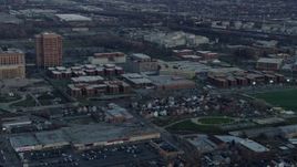 4K aerial stock footage of approaching Cook County Department of Corrections complex at sunset in West Side Chicago, Illinois Aerial Stock Footage | AX0163_0021
