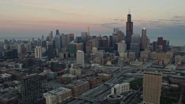 4K aerial stock footage of slowly flying by the Downtown Chicago skyline at sunset, Illinois Aerial Stock Footage | AX0163_0026