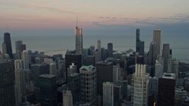 4K aerial stock footage of Trump Tower reflecting the sunset and downtown high-rises, Downtown Chicago, Illinois Aerial Stock Footage | AX0163_0031