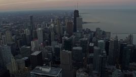 4K aerial stock footage of downtown high-rises and skyscrapers along Lake Michigan at sunset, Downtown Chicago, Illinois Aerial Stock Footage | AX0163_0033