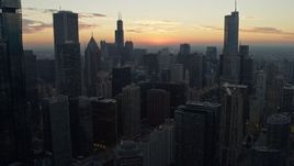 4K aerial stock footage of flying over skyscrapers at sunset, Downtown Chicago, Illinois Aerial Stock Footage | AX0163_0037
