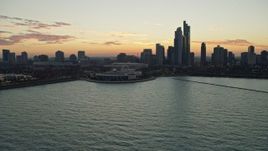 4K aerial stock footage flyby Shedd Aquarium, city skyline at twilight, Downtown Chicago, Illinois Aerial Stock Footage | AX0163_0044