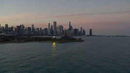 4K aerial stock footage orbit Adler Planetarium, reveal and city skyline at twilight, Downtown Chicago, Illinois Aerial Stock Footage | AX0163_0046