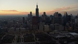 4K aerial stock footage Willis Tower and skyscrapers seen from Grant Park at twilight, Downtown Chicago, Illinois Aerial Stock Footage | AX0163_0049