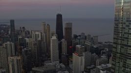4K aerial stock footage fly past Trump Tower to reveal John Hancock Center at twilight in Downtown Chicago, Illinois Aerial Stock Footage | AX0163_0052