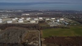 4K aerial stock footage of flying by giant storage tanks in Lemont, Illinois Aerial Stock Footage | AX0165_0002