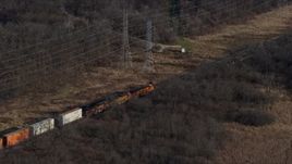 4K aerial stock footage of a train cruising past the countryside  in Lemont, Illinois Aerial Stock Footage | AX0165_0004