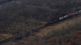 4K aerial stock footage of a reverse view of a train cruising past the countryside  in Lemont, Illinois Aerial Stock Footage | AX0165_0005
