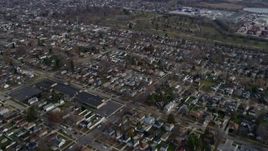 4K aerial stock footage of tilting from suburban neighborhoods in Forest View and Stickney, Illinois, reveal Downtown Chicago skyline Aerial Stock Footage | AX0165_0012