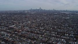 4K aerial stock footage of flying over West Side suburban neighborhoods toward Downtown Chicago, Illinois skyline Aerial Stock Footage | AX0165_0015
