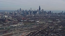 4K aerial stock footage of approaching the Downtown Chicago, Illinois skyline from the West Side Aerial Stock Footage | AX0165_0023