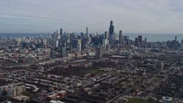 4K aerial stock footage of flying toward the Downtown Chicago, Illinois skyline from the West Side Aerial Stock Footage | AX0165_0024