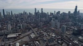 4K aerial stock footage of flying past tall skyscrapers in Downtown Chicago, Illinois Aerial Stock Footage | AX0165_0028