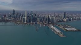 4K aerial stock footage of passing by tall, waterfront skyscrapers and Navy Pier in Downtown Chicago, Illinois Aerial Stock Footage | AX0165_0035