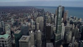 4K aerial stock footage of following State Street past Downtown Chicago skyscrapers, Illinois Aerial Stock Footage | AX0165_0052