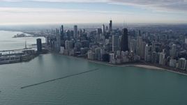4K aerial stock footage of approaching waterfront skyscrapers from Lake Michigan in Downtown Chicago, Illinois Aerial Stock Footage | AX0165_0056