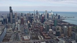 4K aerial stock footage of a reverse view of the city's skyscrapers in Downtown Chicago, Illinois Aerial Stock Footage | AX0165_0060