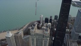 4K aerial stock footage fly over skyscrapers to reveal Lake Shore Drive and Navy Pier in Downtown Chicago, Illinois Aerial Stock Footage | AX0165_0067