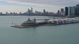 4K aerial stock footage of circling around Navy Pier to reveal Downtown Chicago skyline, Illinois Aerial Stock Footage | AX0165_0069