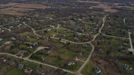 4K aerial stock footage of flying by peaceful suburban neighborhoods in Lake Zurich, Illinois Aerial Stock Footage | AX0166_0034