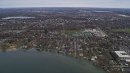 4K aerial stock footage of flying over lakeside homes and high school in Grayslake, Illinois Aerial Stock Footage | AX0166_0039