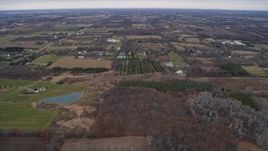 4K aerial stock footage of flying over rural homes, farms and fields in Franksville, Wisconsin Aerial Stock Footage | AX0166_0056