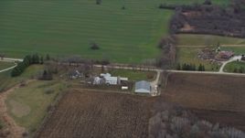 4K aerial stock footage of flying past farms and fields in Franksville, Wisconsin Aerial Stock Footage | AX0166_0057