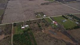 4K aerial stock footage of a red barn and farm fields in Franksville, Wisconsin Aerial Stock Footage | AX0166_0058