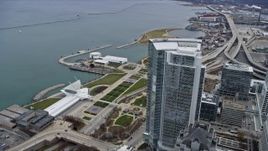 4K aerial stock footage of flying by skyscraper and lakefront museums in Milwaukee, Wisconsin Aerial Stock Footage | AX0166_0076