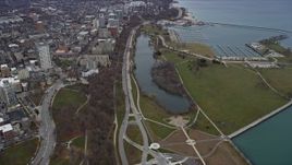 4K aerial stock footage fly over downtown skyscraper to approach Veterans Park and marina in Milwaukee, Wisconsin Aerial Stock Footage | AX0166_0083