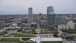 4K aerial stock footage fly over Milwaukee Art Museum and between skyscrapers in Milwaukee, Wisconsin Aerial Stock Footage | AX0166_0084