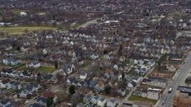 4K aerial stock footage of flying past suburban homes in Milwaukee, Wisconsin Aerial Stock Footage | AX0166_0088