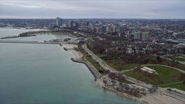 4K aerial stock footage of approaching skyscrapers in downtown and waterfront park, Milwaukee, Wisconsin Aerial Stock Footage | AX0167_0009