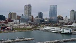 4K aerial stock footage fly over museum and between skyscrapers, Milwaukee, Wisconsin Aerial Stock Footage | AX0167_0014