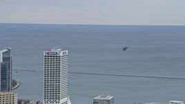 4K aerial stock footage of tracking a helicopter from Lake Michigan to downtown, Milwaukee, Wisconsin Aerial Stock Footage | AX0167_0018