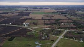 4K aerial stock footage of flying over fields and farms in Franksville, Wisconsin Aerial Stock Footage | AX0167_0042